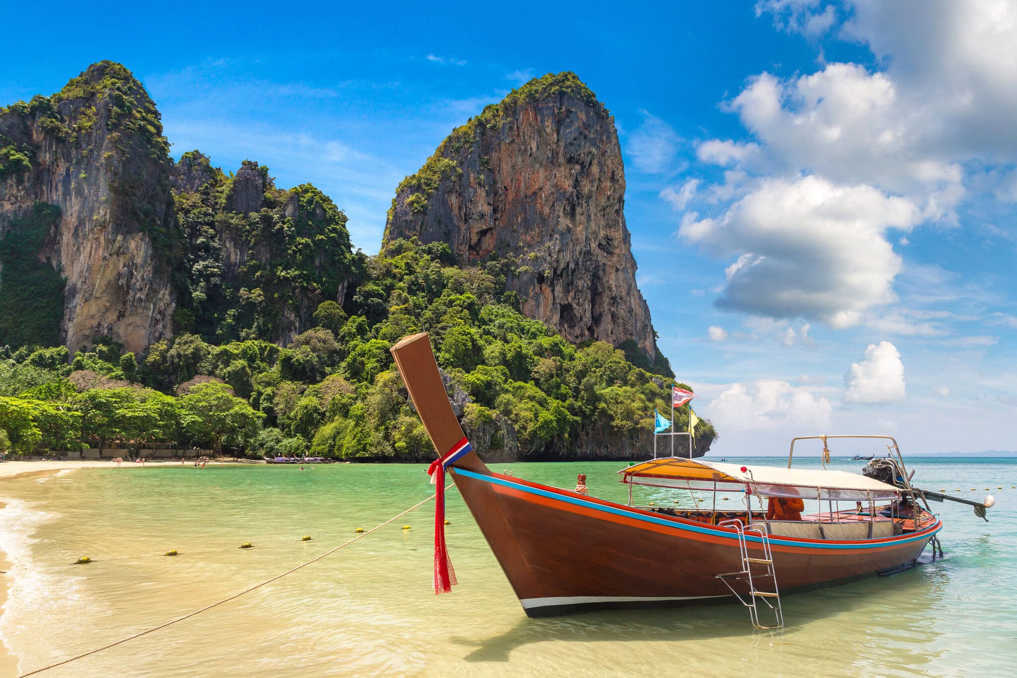 Traditional long tail boat on Railay Beach, Krabi, Thailand in